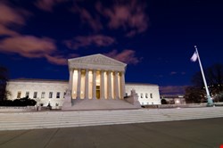 The US Department of Justice (DoJ) is urging the Supreme Court to halt a legal challenge to a warrantless surveillance program 