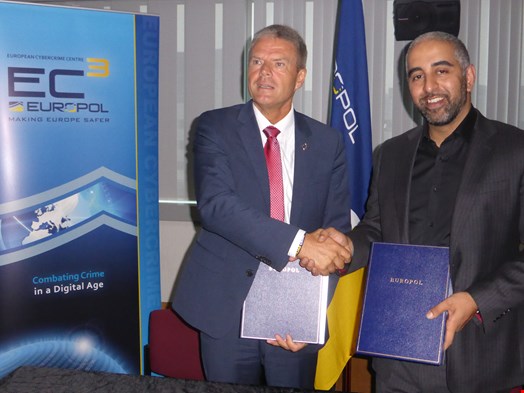 Samani with Troels Oerting, signing the MoU with Europol's European Cybercrime Center (EC3)