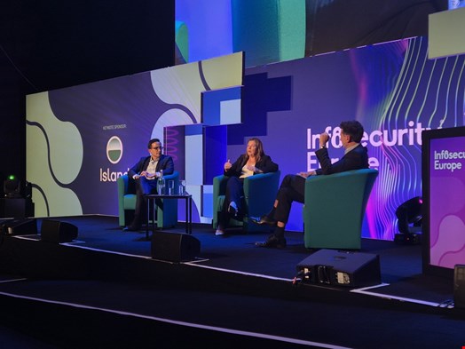 Ashish Shrestha (left) and Nicola Hudson (center) discussing cybersecurity crisis management at Infosecurity Europe