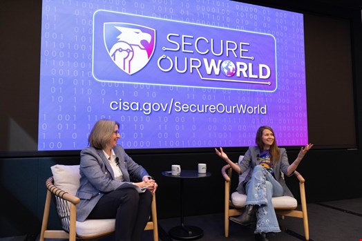 Easterly (right) speaking about 'Secure Our World', a CISA program that offers resources and advice to stay safe online. (Source: CISA)