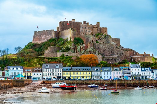 Mount Orgueil castle over the Gorey village promenade, Saint Martin, bailiwick of Jersey, Channel Islands.